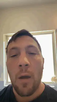 man yawning and blinking