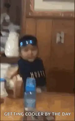Kid puts on sunglasses