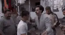 Borat slaps a man in the market