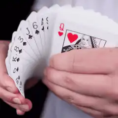 Hand fanning playing cards