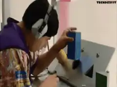 Man puts phone in slot and looks at camera