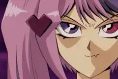 Akiza Izinski holds up a reverse card