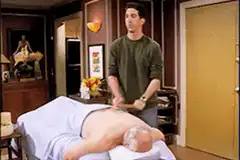 Ross gives a back massage with a wooden spoon
