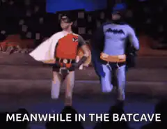 Batman and Robin dancing in the Batcave