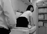 Woman on copier looking shocked
