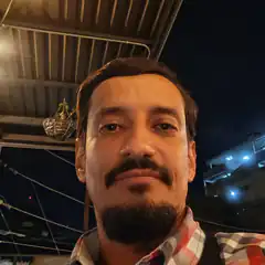 Man with mustache and goatee at night