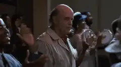 Robert De Niro clapping in a church