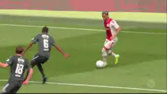 Ajax player dribbles past defenders