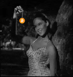 Woman swinging bitcoin pendant