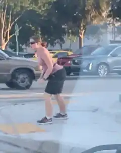 woman dancing in parking lot