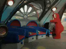 Po from Teletubbies falls asleep in a chair