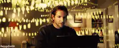 Bradley Cooper looking at laptop