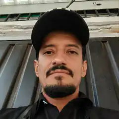 Man in black cap and shirt