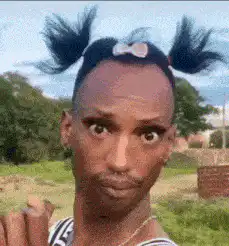 Man with pigtails making funny faces
