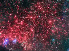 Red and blue fireworks exploding