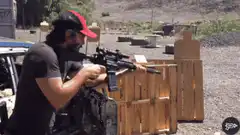 Man shooting rifle at outdoor range