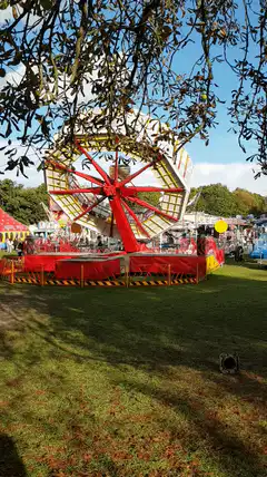 Red and yellow spinning fairground ride