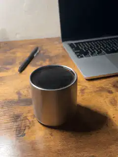 Steam rising from a metal cup