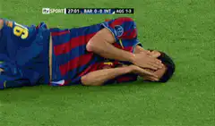 Football player covers face in despair