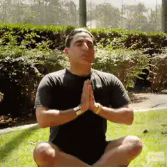 Man meditating in the park