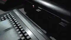 Man typing on keyboard with wireframe chest on screen