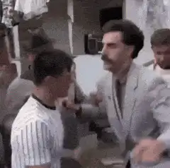 Borat fights a man in a street