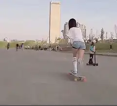 Girl longboarding in a park