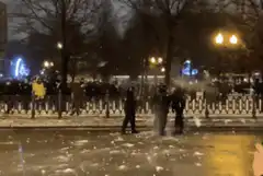 Police officers dancing in the snow