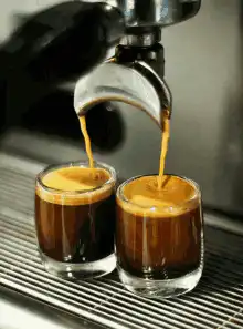 espresso pouring into two glasses