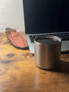Steam rising from a metal cup