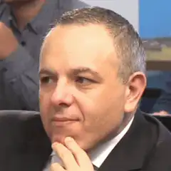 Man in suit looking thoughtful