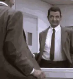 Mr. Bean admiring himself in the mirror