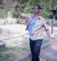 Man in leopard print shirt dancing outside