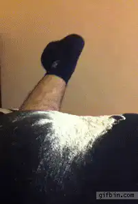 Leg kicks up white powder