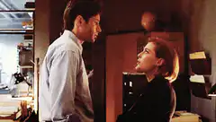 Dana Scully looking up at Fox Mulder