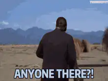 Man in desert with tumbleweed