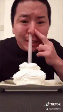 Man drinks whipped cream through nose
