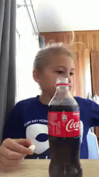 Girl drops mentos in coke