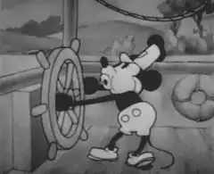Mickey Mouse steering a ship