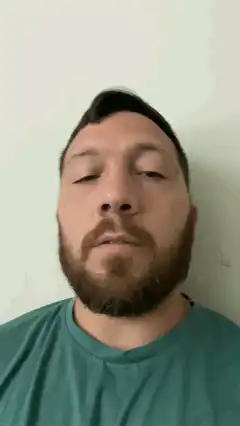 Man tilting head back and forth