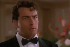 Charlie Sheen adjusting his bowtie