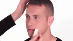 Man gets clown makeup and wig