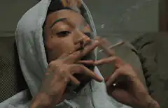 Lil Wayne smoking two cigarettes