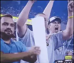 Fan holds toilet paper to his face