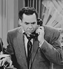Man on phone eyes widen