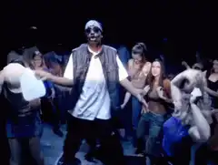 Man dancing in a club with crowd
