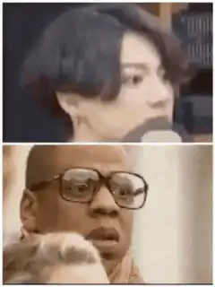 Man with glasses looking shocked