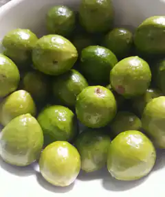 Green olives in a white bowl