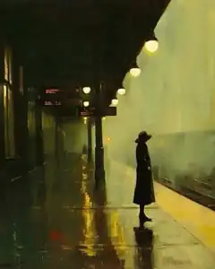 Woman waiting on rainy train platform