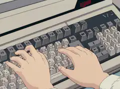 Hands typing on a vintage NEC keyboard
